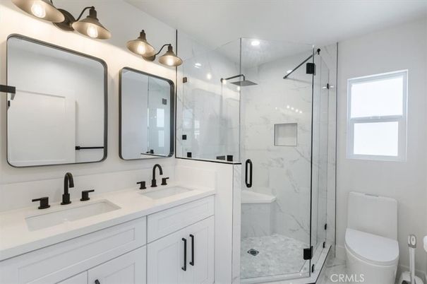 Bathroom, Dual Sink Vanities, Glass Shower, Interior, Marble Walls, Recessed Lighting