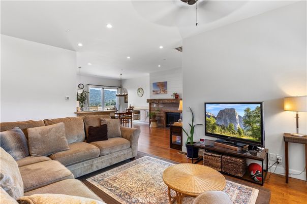 Dining room, Fireplace, Interior, Living room, Pendant Lights, Recessed Lighting, Wood Texture Flooring