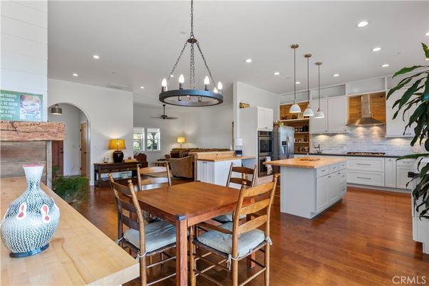 Chandelier, Dining room, Interior, Kitchen, Pendant Lights, Recessed Lighting, Stainless Steel Appliances, Wood Texture Flooring