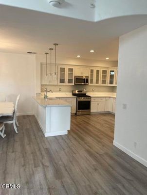 Dining room, Interior, Kitchen, Pendant Lights, Recessed Lighting, Stainless Steel Appliances, Wood Texture Flooring
