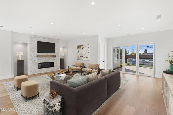 Fireplace, Interior, Living room, Recessed Lighting, Stone Walls, Wood Texture Flooring