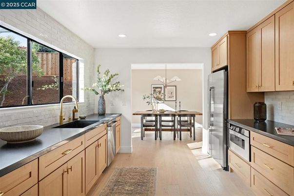 Dining room, Interior, Kitchen, Recessed Lighting, Stainless Steel Appliances, Wood Texture Flooring