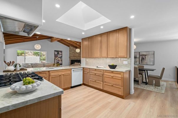 Dining room, Fireplace, Interior, Kitchen, Living room, Pendant Lights, Recessed Lighting, Stainless Steel Appliances, Wood Texture Flooring