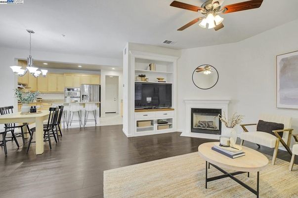 Chandelier, Dining room, Fireplace, Interior, Kitchen, Pendant Lights, Recessed Lighting, Stainless Steel Appliances, Wood Texture Flooring