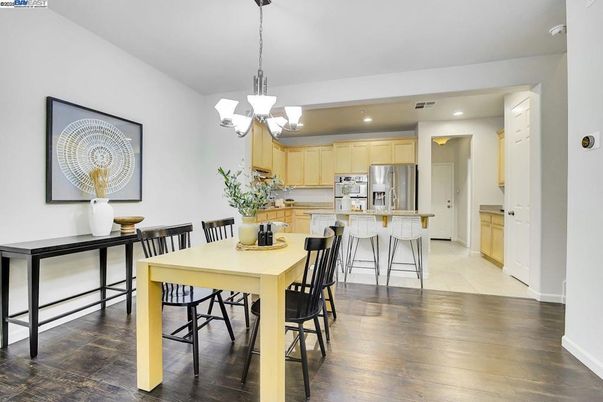 Chandelier, Dining room, Interior, Kitchen, Pendant Lights, Recessed Lighting, Stainless Steel Appliances, Wood Texture Flooring