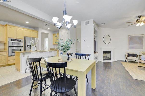 Chandelier, Dining room, Fireplace, Interior, Kitchen, Recessed Lighting, Stainless Steel Appliances, Wood Texture Flooring