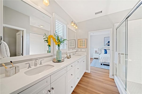 Bathroom, Bedroom, Dual Sink Vanities, Glass Shower, Interior, Wood Texture Flooring