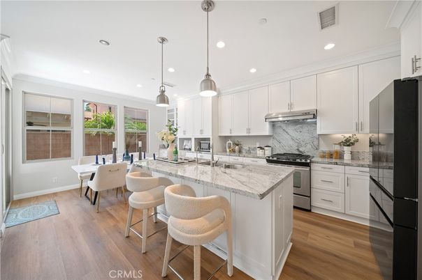 Dining room, Interior, Kitchen, Pendant Lights, Recessed Lighting, Stainless Steel Appliances, Wood Texture Flooring