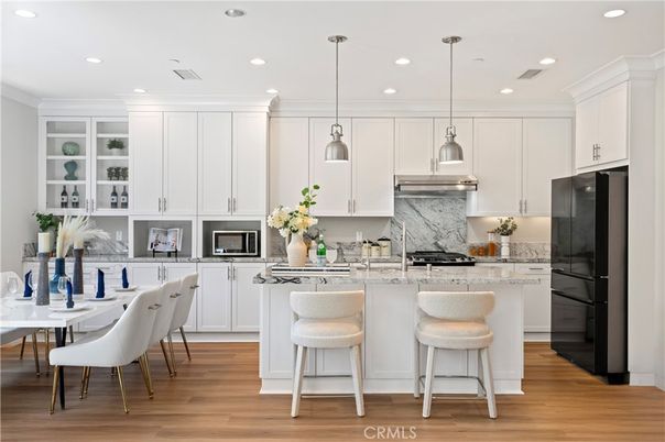 Dining room, Interior, Kitchen, Pendant Lights, Recessed Lighting, Stainless Steel Appliances, Wood Texture Flooring