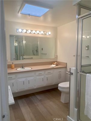 Bathroom, Dual Sink Vanities, Glass Shower, Interior, Wood Texture Flooring