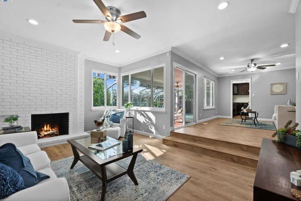 Fireplace, Interior, Living room, Recessed Lighting, Stone Walls, Wood Texture Flooring
