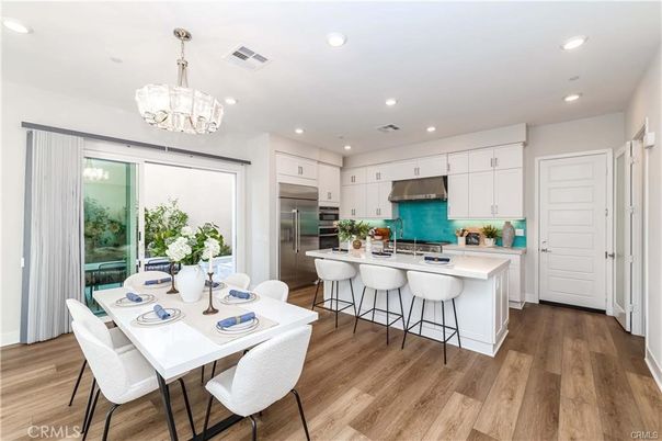 Chandelier, Dining room, Interior, Kitchen, Recessed Lighting, Stainless Steel Appliances, Wood Texture Flooring