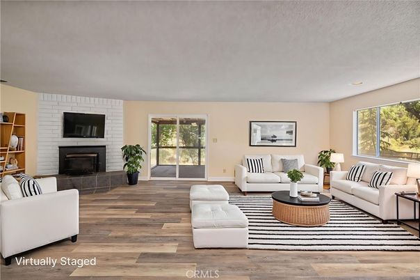 Fireplace, Interior, Living room, Recessed Lighting, Stone Walls, Wood Texture Flooring