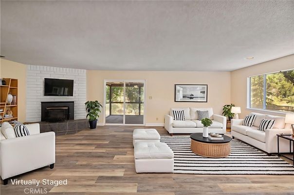 Fireplace, Interior, Living room, Recessed Lighting, Stone Walls, Wood Texture Flooring