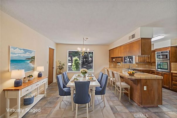 Chandelier, Dining room, Interior, Kitchen, Stainless Steel Appliances, Tile Countertops