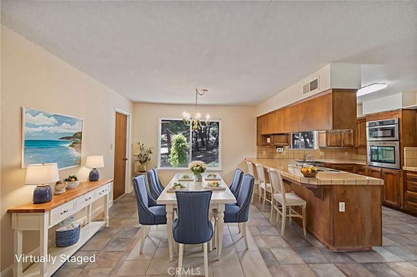 Chandelier, Dining room, Interior, Kitchen, Stainless Steel Appliances, Tile Countertops