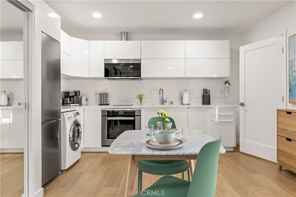 Interior, Kitchen, Recessed Lighting, Stainless Steel Appliances, Washer, Wood Texture Flooring