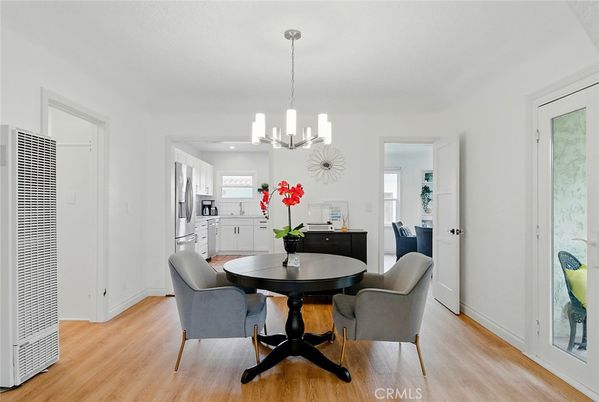 Chandelier, Dining room, Interior, Kitchen, Pendant Lights, Recessed Lighting, Stainless Steel Appliances, Wood Texture Flooring