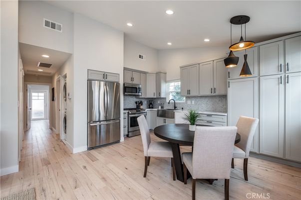 Dining room, Interior, Kitchen, Pendant Lights, Recessed Lighting, Stainless Steel Appliances, Wood Texture Flooring