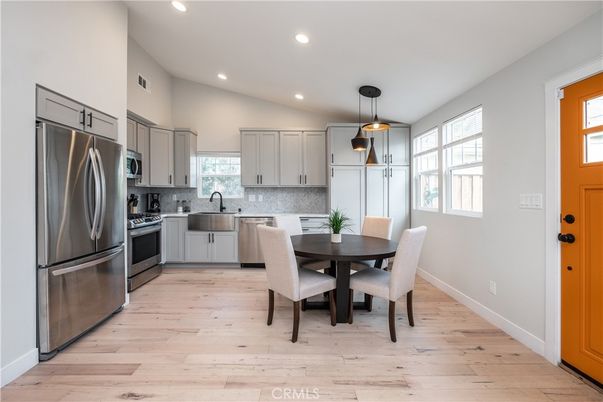 Dining room, Interior, Kitchen, Pendant Lights, Recessed Lighting, Stainless Steel Appliances, Wood Texture Flooring