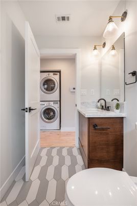 Bathroom, Dual Sink Vanities, Interior, Washer, Wood Texture Flooring