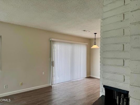 Empty room, Fireplace, Interior, Pendant Lights, Stone Walls, Wood Texture Flooring