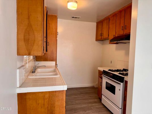 Interior, Kitchen, Tile Countertops, Wood Texture Flooring