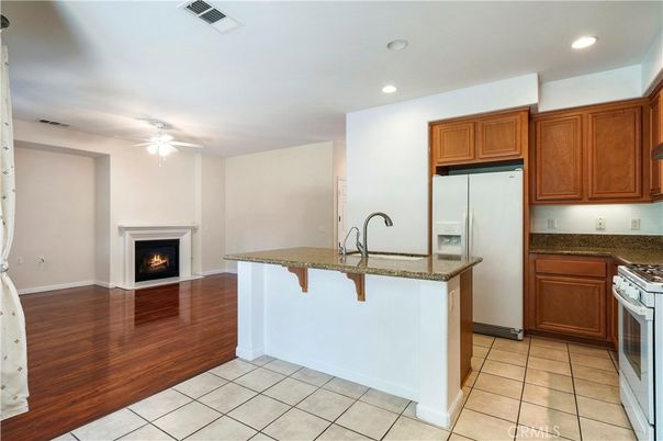 Empty room, Fireplace, Interior, Kitchen, Recessed Lighting, Wood Texture Flooring