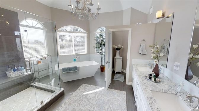 Bathroom, Chandelier, Dual Sink Vanities, Free Standing Baths, Glass Shower, Interior, Wood Texture Flooring