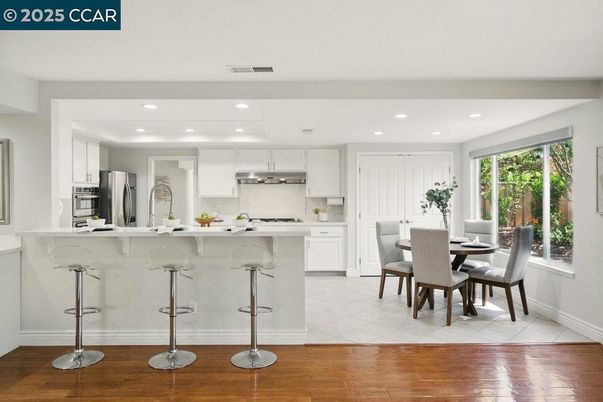 Dining room, Interior, Kitchen, Recessed Lighting, Stainless Steel Appliances, Wood Texture Flooring