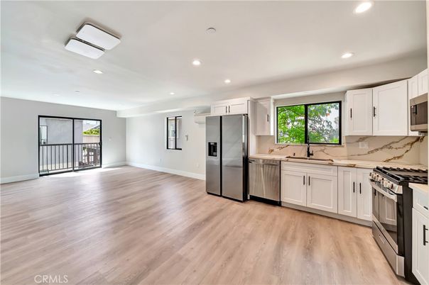 Interior, Kitchen, Marble Walls, Recessed Lighting, Stainless Steel Appliances, Wood Texture Flooring