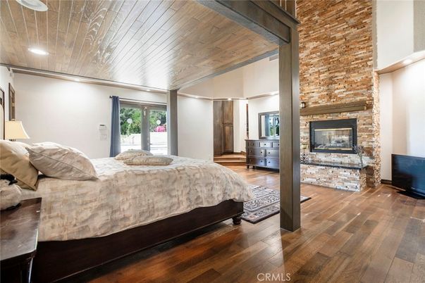 Bedroom, Fireplace, Interior, Recessed Lighting, Stone Walls, Wooden Ceilings, Wood Texture Flooring