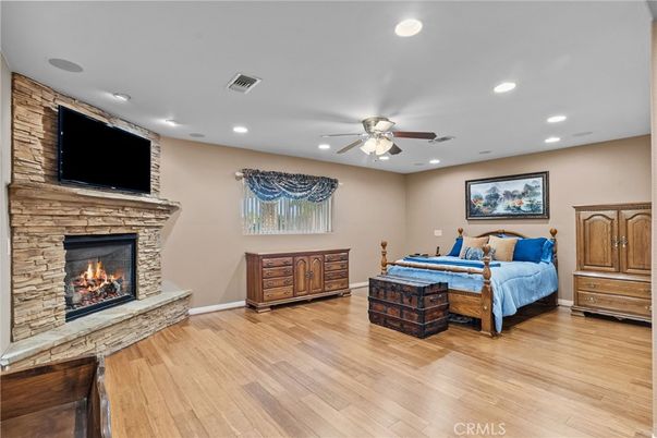 Bedroom, Fireplace, Interior, Recessed Lighting, Wood Texture Flooring