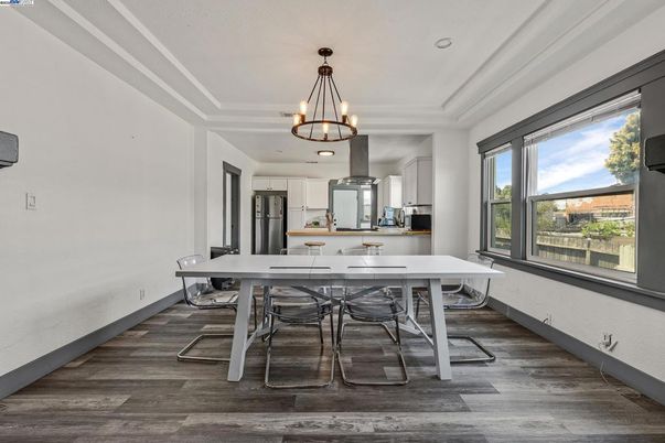 Chandelier, Dining room, Interior, Kitchen, Pendant Lights, Recessed Lighting, Stainless Steel Appliances, Wood Texture Flooring
