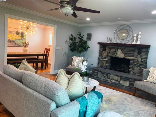 Dining room, Fireplace, Interior, Living room, Recessed Lighting, Wood Texture Flooring