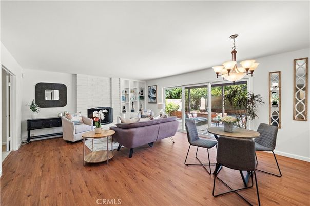 Chandelier, Dining room, Fireplace, Interior, Living room, Stone Walls, Wood Texture Flooring