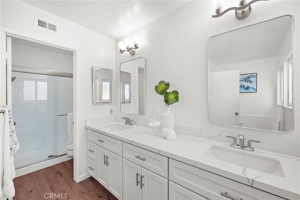 Bathroom, Dual Sink Vanities, Glass Shower, Interior, Wood Texture Flooring