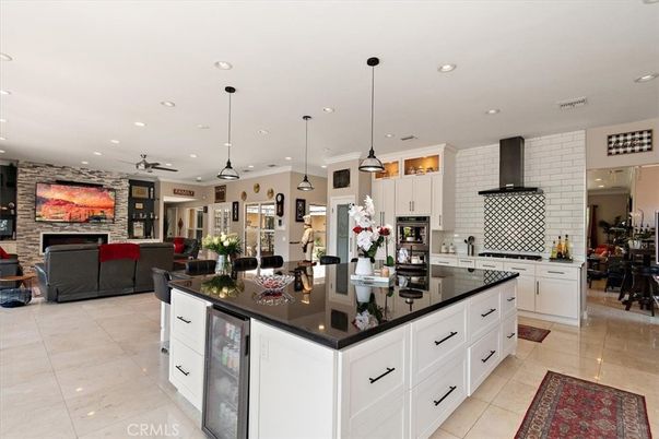 Fireplace, Interior, Kitchen, Living room, Pendant Lights, Recessed Lighting, Stainless Steel Appliances, Stone Walls