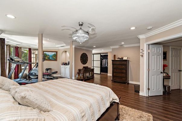 Bedroom, Chandelier, Fitness Equipment, Interior, Recessed Lighting, Wood Texture Flooring