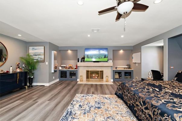 Bedroom, Fireplace, Interior, Recessed Lighting, Wood Texture Flooring