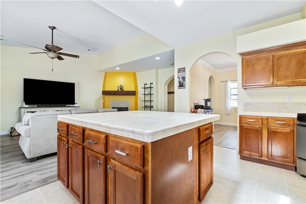 Fireplace, Interior, Kitchen, Recessed Lighting, Tile Countertops, Wood Texture Flooring