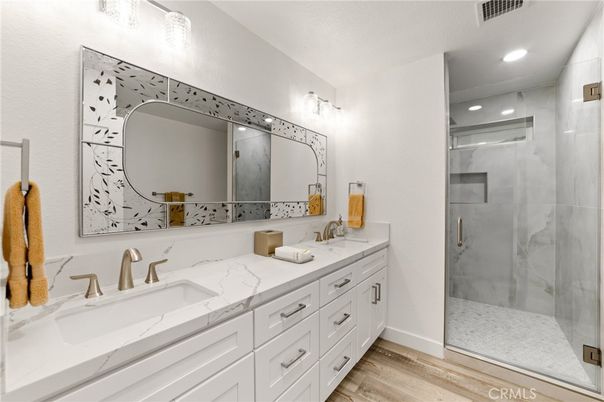 Bathroom, Dual Sink Vanities, Glass Shower, Interior, Recessed Lighting, Wood Texture Flooring