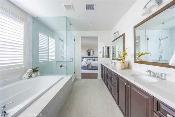 Bathroom, Bedroom, Dual Sink Vanities, Glass Shower, Interior, Recessed Lighting, Wood Texture Flooring