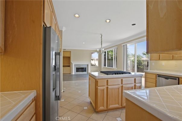 Fireplace, Interior, Kitchen, Pendant Lights, Recessed Lighting, Stainless Steel Appliances, Tile Countertops