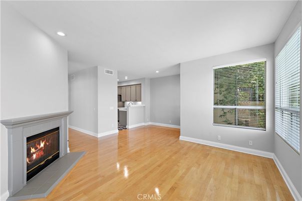 Empty room, Fireplace, Interior, Kitchen, Recessed Lighting, Wood Texture Flooring