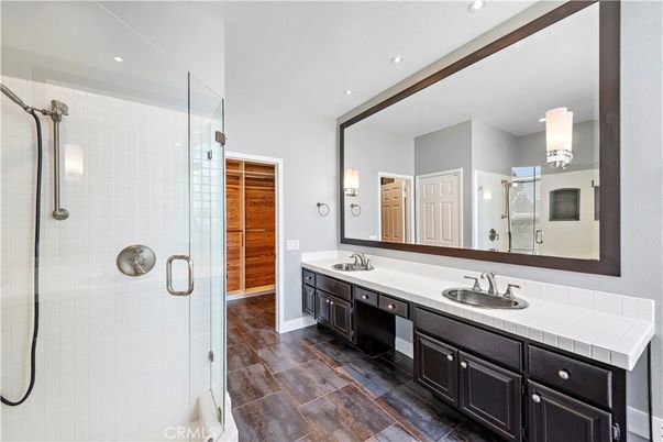 Bathroom, Dual Sink Vanities, Glass Shower, Interior, Recessed Lighting, Tile Countertops