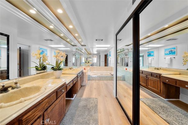 Bathroom, Dual Sink Vanities, Glass Shower, Interior, Recessed Lighting, Wood Texture Flooring