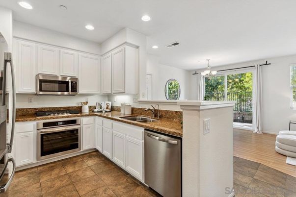 Chandelier, Interior, Kitchen, Recessed Lighting, Stainless Steel Appliances, Wood Texture Flooring