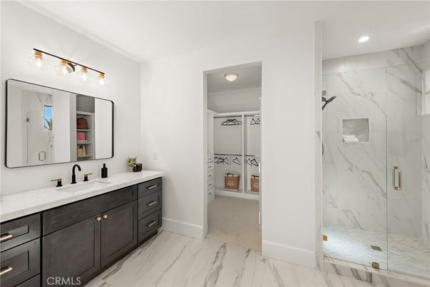 Bathroom, Dual Sink Vanities, Glass Shower, Interior, Marble, Marble Walls, Recessed Lighting