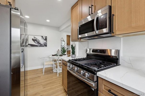 Dining room, Interior, Kitchen, Recessed Lighting, Stainless Steel Appliances, Wood Texture Flooring